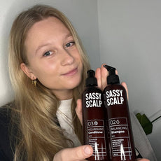 scalp duo person holding the products