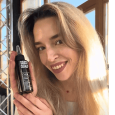 healing serum person holding the product