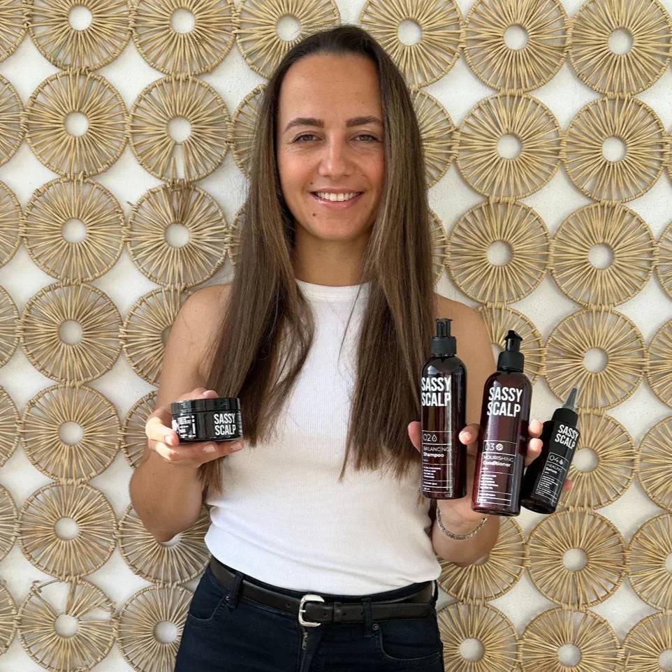 scalp kit person holding the products